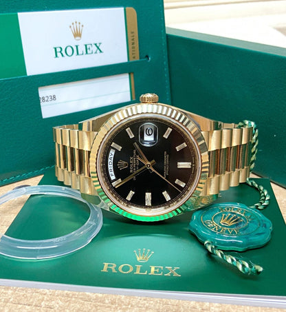 Rolex Day-Date Yellow Gold baguette black dial